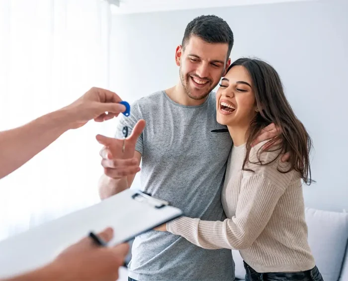A couple receiving a set of keys